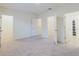 Bedroom featuring neutral walls, plush carpet, and doorways to a closet and the ensuite bathroom at 11054 Crescent Deer Dr, Land O Lakes, FL 34638