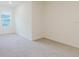 Well-lit bedroom with a large window and neutral carpeting at 11054 Crescent Deer Dr, Land O Lakes, FL 34638