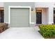 Charming home exterior featuring a garage door, walkway, and inviting front door with a wreath at 11054 Crescent Deer Dr, Land O Lakes, FL 34638