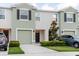 Charming townhome featuring a one-car garage, and nicely manicured landscaping at 11054 Crescent Deer Dr, Land O Lakes, FL 34638