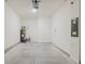 Clean, empty garage featuring ample space, white walls, concrete flooring, and convenient access door at 11054 Crescent Deer Dr, Land O Lakes, FL 34638