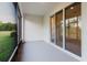 Covered porch with screens and slider at 11054 Crescent Deer Dr, Land O Lakes, FL 34638