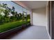 View of the screened-in porch with green views at 11054 Crescent Deer Dr, Land O Lakes, FL 34638