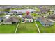 Aerial view of the property showcasing the home, large backyard and neighborhood pond at 11719 Tetrafin Dr, Riverview, FL 33579