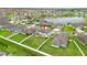 An aerial view showcases a home with a spacious backyard and a serene pond nearby at 11719 Tetrafin Dr, Riverview, FL 33579