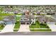 Aerial view of the property featuring lush landscaping, green lawn, and community views at 11719 Tetrafin Dr, Riverview, FL 33579