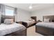 Bright bedroom features matching wooden bed frames, side tables and carpet flooring at 11719 Tetrafin Dr, Riverview, FL 33579