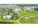 Aerial of community amenities with a pool, splashpad, playground, sports courts, and walking paths at 11719 Tetrafin Dr, Riverview, FL 33579