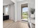 Inviting foyer with wood look tile and plenty of natural light at 11719 Tetrafin Dr, Riverview, FL 33579