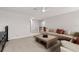 Spacious living room with large sectional sofa, wooden coffee table, and neutral-toned carpet at 11719 Tetrafin Dr, Riverview, FL 33579