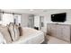 Main bedroom with plush bed and ensuite bathroom access with bright natural light at 11719 Tetrafin Dr, Riverview, FL 33579