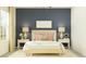 Cozy bedroom featuring soft lighting, neutral decor, and stylish bedside tables at 11836 Blue Diamond Trl, Parrish, FL 34219