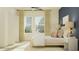 Bright and airy bedroom with natural light, comfortable bedding, and minimalist decor at 11836 Blue Diamond Trl, Parrish, FL 34219