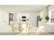 Dining and kitchen area with white cabinets and stainless steel appliances at 11836 Blue Diamond Trl, Parrish, FL 34219