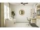 Cozy home office with bookshelves, a desk, and comfortable seating area at 11836 Blue Diamond Trl, Parrish, FL 34219