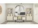 Well-lit home office featuring built-in bookshelves and a modern desk setup at 11836 Blue Diamond Trl, Parrish, FL 34219