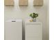 Laundry area with white washer and dryer units and shelf space at 11836 Blue Diamond Trl, Parrish, FL 34219