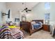 Primary bedroom with natural light, ample space, and a decorative stained glass window at 12214 Buckingham Way, Spring Hill, FL 34609