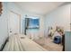 This secondary bedroom has a clean design and neutral color palette at 12214 Buckingham Way, Spring Hill, FL 34609