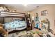 Bedroom with bunk beds, toys, and colorful decorations at 12214 Buckingham Way, Spring Hill, FL 34609