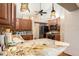 Kitchen with granite countertops, lots of cabinet space and stone tile backsplash at 12214 Buckingham Way, Spring Hill, FL 34609