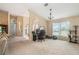 Spacious living room area with vaulted ceilings and lots of natural light at 12214 Buckingham Way, Spring Hill, FL 34609