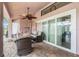 Covered patio with ceiling fan, seating and access to the pool at 12214 Buckingham Way, Spring Hill, FL 34609