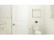 Bathroom featuring a white toilet and neutral wall art and decor at 12313 Precious Ruby Way, Parrish, FL 34219