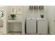 Convenient laundry room with washer, dryer, and built in folding station at 12313 Precious Ruby Way, Parrish, FL 34219
