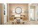 Stylish office space with a modern desk, decorative mirror, and ample natural light at 12313 Precious Ruby Way, Parrish, FL 34219