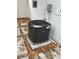 Image of the outdoor AC unit and related electrical hardware at 12502 Cambridge Ave, Tampa, FL 33624