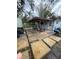 Outdoor patio area featuring pavers and a covered seating area, perfect for outdoor entertaining or enjoying the backyard at 12502 Cambridge Ave, Tampa, FL 33624
