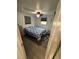 Cozy bedroom with a comfortable bed, ceiling fan, and neutral decor, perfect for relaxation at 12502 Cambridge Ave, Tampa, FL 33624