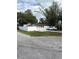 Inviting home featuring a neatly kept front yard and a classic white picket fence, creating a warm and welcoming atmosphere at 12502 Cambridge Ave, Tampa, FL 33624