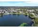 An aerial view of a lake surrounded by a dense neighborhood at 12529 Mondragon Dr, Tampa, FL 33625