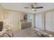 Bedroom featuring a cozy queen bed, a dresser, and views of the outdoors at 12529 Mondragon Dr, Tampa, FL 33625