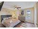 Comfortable bedroom boasting a cozy queen bed, dresser, and serene views of the outdoors at 12529 Mondragon Dr, Tampa, FL 33625
