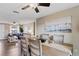 Open-concept dining room features stylish furnishings and coastal-themed decor, perfect for entertaining at 12529 Mondragon Dr, Tampa, FL 33625