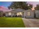Charming home with a well-maintained lawn and updated landscaping at 12529 Mondragon Dr, Tampa, FL 33625