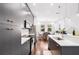 Modern kitchen featuring sleek gray cabinetry, stainless steel appliances, and a breakfast bar at 1330 W Gray St # 2, Tampa, FL 33606