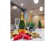 Stylish kitchen setting with champagne bottle and glasses atop white countertop, highlighting a festive occasion at 1330 W Gray St # 2, Tampa, FL 33606