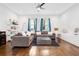 Bright living room featuring hardwood floors, recessed lighting, and two comfortable sofas with large windows at 1330 W Gray St # 2, Tampa, FL 33606