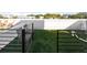 Private rooftop deck with artificial grass and plenty of seating, offering an ideal outdoor retreat at 1330 W Gray St # 2, Tampa, FL 33606