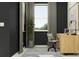 Cozy home office with a modern desk, stylish chair, large windows, and a calming plant at 13510 White Gold Run, Parrish, FL 34219