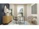 Contemporary home office with a marble-top desk, modern chairs, and stylish decor at 13510 White Gold Run, Parrish, FL 34219