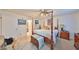 Cozy bedroom with four poster bed, storage chest and attached bathroom for added convenience at 1417 Langley Dr, Sun City Center, FL 33573