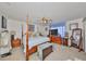 Spacious primary bedroom with four poster bed, ceiling fan and plenty of natural light at 1417 Langley Dr, Sun City Center, FL 33573