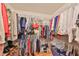 Walk-in closet with metal rack shelving providing ample storage for clothes and accessories at 1417 Langley Dr, Sun City Center, FL 33573