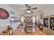 Cozy dining area featuring wood floors, a ceiling fan, and natural light at 1417 Langley Dr, Sun City Center, FL 33573