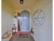 Charming front entrance with decorative accents and a welcoming ambiance, perfect for greeting guests at 1417 Langley Dr, Sun City Center, FL 33573